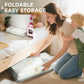 Foldable reversible baby play mat stacked for easy storage, light gray print