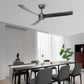 Modern ceiling fan with LED light and three dark blades above a dining table