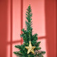 Green artificial pencil Christmas tree with a golden star ornament topper