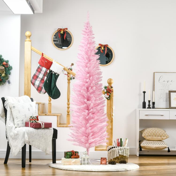 Pink pencil artificial Christmas tree on a round white base stand, unlit