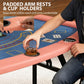 Poker table corner with padded armrest and built-in cup holder on blue felt