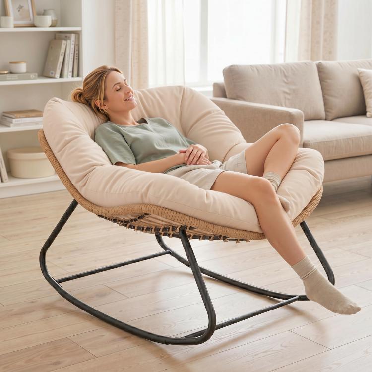 Cream rocking egg chair with thick cushion and woven base, black curved rockers