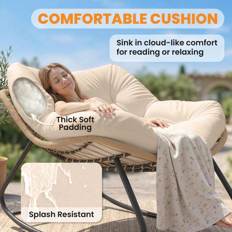 Cream papasan rocking chair with cushioned seat, woven base, and black steel frame