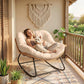 Cream white papasan rocking chair with plush cushion, woven rattan sides, and black base