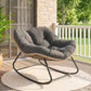 Dark gray rocking egg chair with padded seat, tufted back, and woven wicker base
