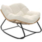 Rocking egg chair with light beige upholstered cushion and black metal frame