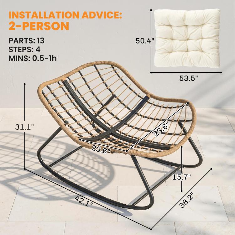 Woven rattan rocking chair frame with cream cushion, black rockers, and arched base