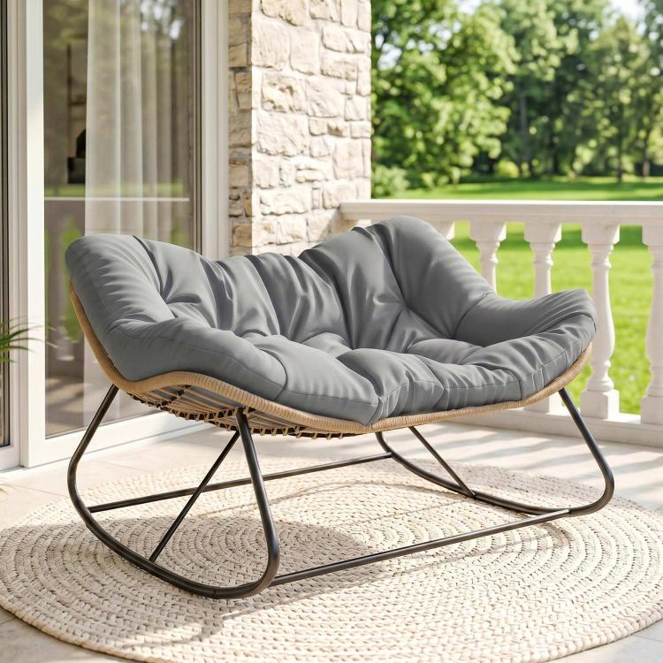 Gray cushioned papasan rocking chair with tan woven seat and black metal rocker stand