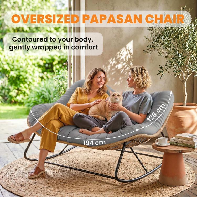 Oversized gray papasan-style rocking chair with tufted cushion and tan wicker base