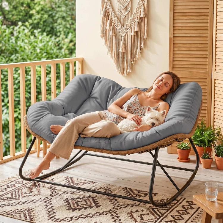 Gray papasan-style rocking chair with thick cushioned seat and black metal rocker base