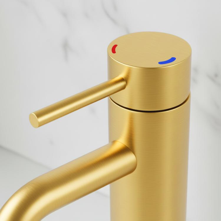 Brushed gold single-handle lavatory faucet, side view of lever and spout