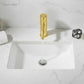Brushed gold single-hole bathroom faucet installed on white sink with water flow