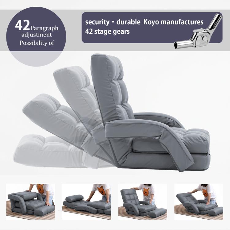 Grey reclined folding lounge chair with cushioned backrest and head pillow