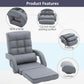 Grey folding lounge chair with thick padded seat cushion and quilted backrest