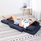 Blue adjustable floor chaise lounge chair reclined with head and waist support pillows.