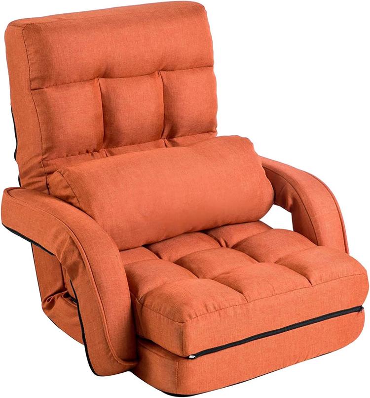 Orange upholstered floor chaise lounge chair with head pillow and padded seat cushions