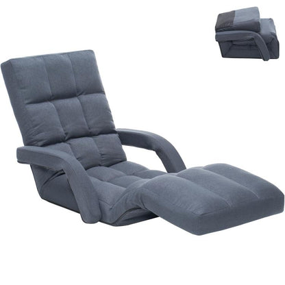 Grey padded floor gaming chair with headrest and adjustable footrest