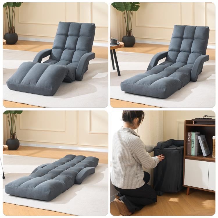 Grey padded floor recline chair with elevated leg rest and contoured back