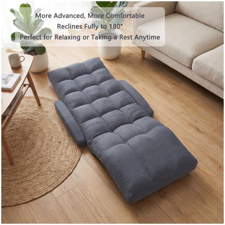 Grey cushioned floor recliner chair lying flat with thick quilted padding
