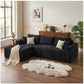 Black corduroy sectional sofa with L-shape, oversized chaise, and throw pillows