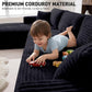 Black corduroy sectional sofa with deep seats and wide arms, shown with child