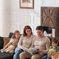 Black corduroy sectional sofa with deep seat cushions and wide chaise arm, family lounging
