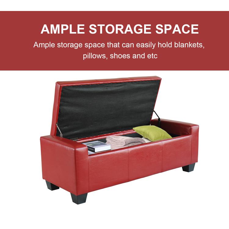 Red faux leather storage ottoman with open lid, black lining, and green cushion inside
