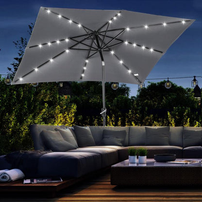 Gray solar LED patio umbrella with fabric canopy and starry light string