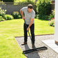 Lawn leveling rake with long handle and wide black base with parallel leveling bars