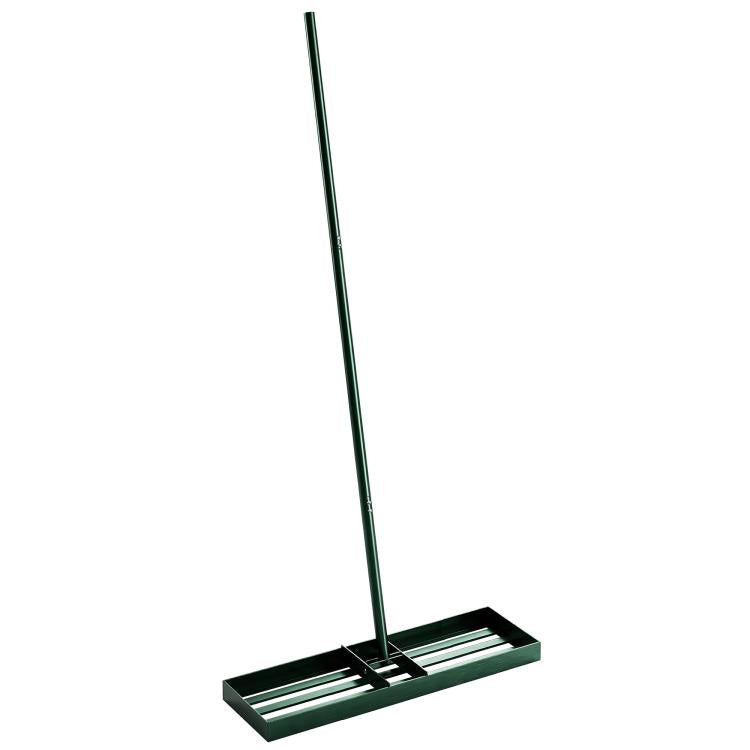 Lawn leveling rake with green handle and wide black base with parallel bars