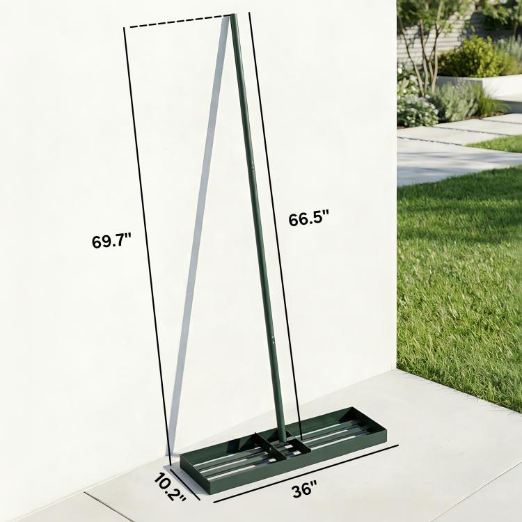 Green lawn leveling rake with handle and ridged base on a patio, size view