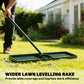 Green lawn leveling rake on grass, with push handle and ridged leveling frame