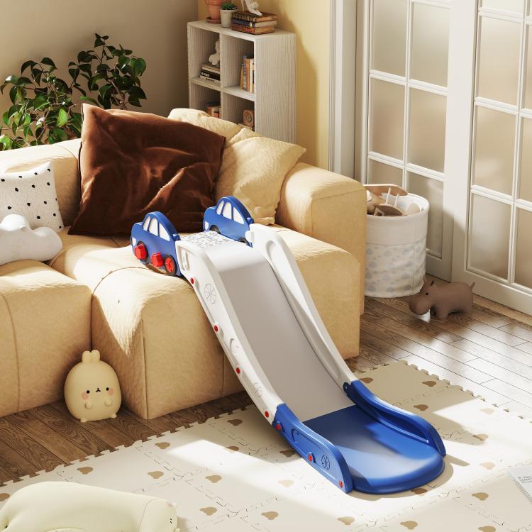 Blue and white toddler slide extended from sofa, with curved base and handrails
