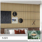 Oak slat acoustic wall panels with dark grid lines and rectangular sections