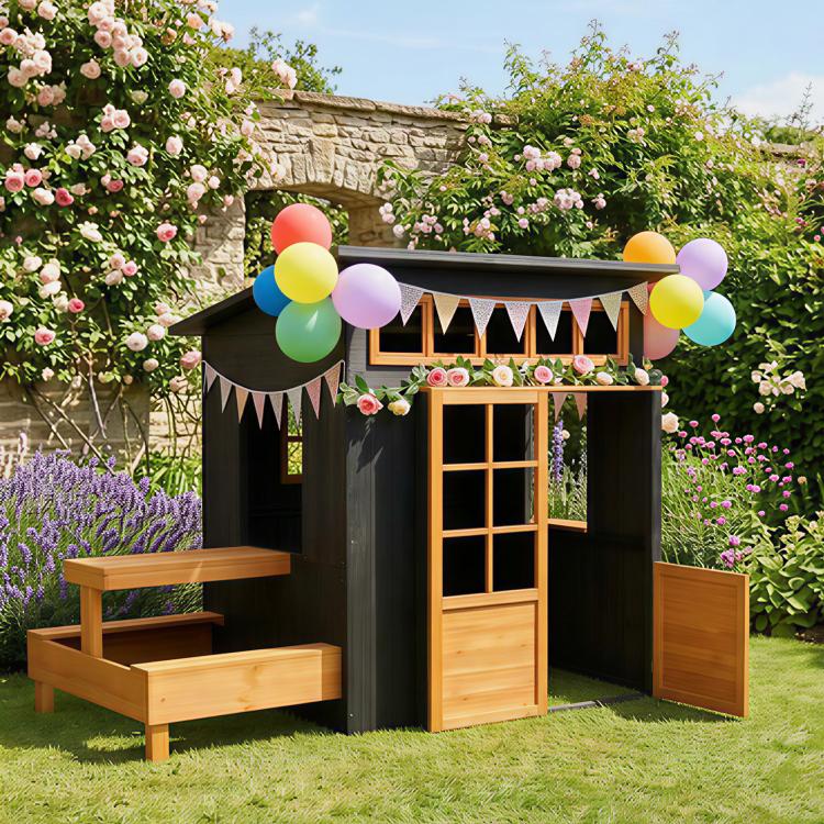 Kids wooden outdoor playhouse with half door, windows, and attached picnic table benches