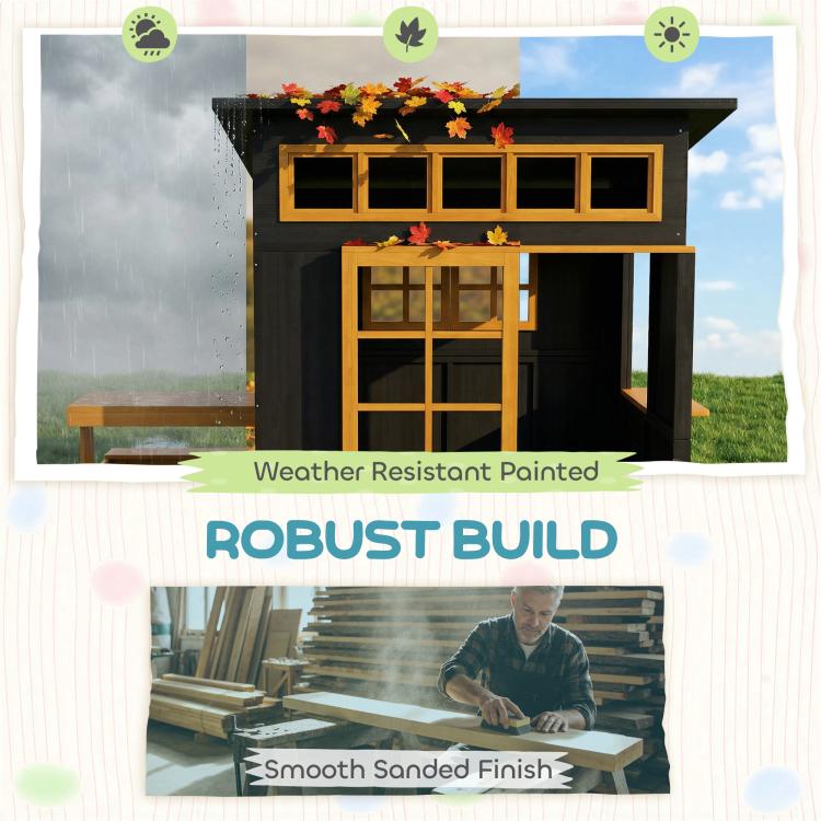 Black wooden playhouse with windowed upper panels and raised picnic table accessory