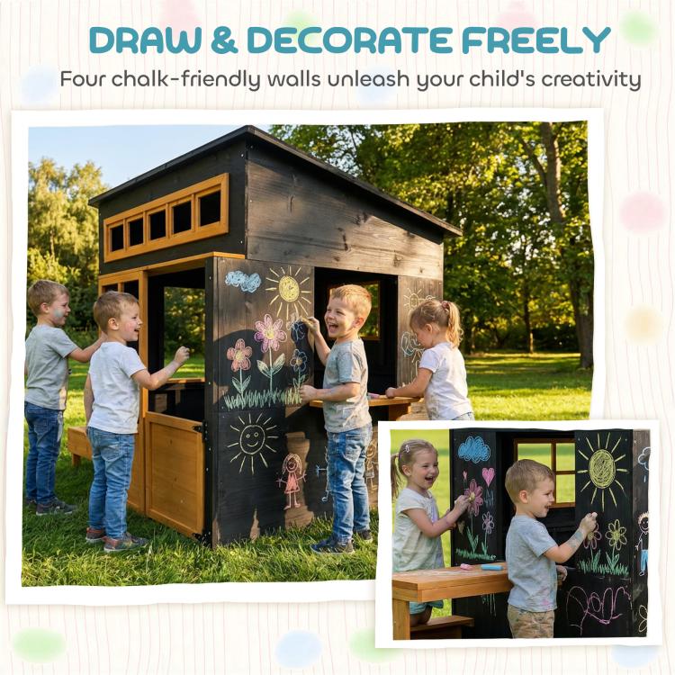 Black wooden playhouse with chalkboard-style walls, open half-door, and picnic table