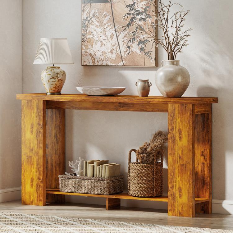 Distressed brown console table with thick top and open lower shelf for decor