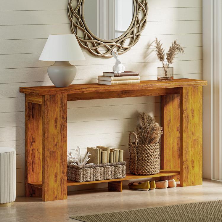 Distressed brown console table with thick top and open shelves for baskets