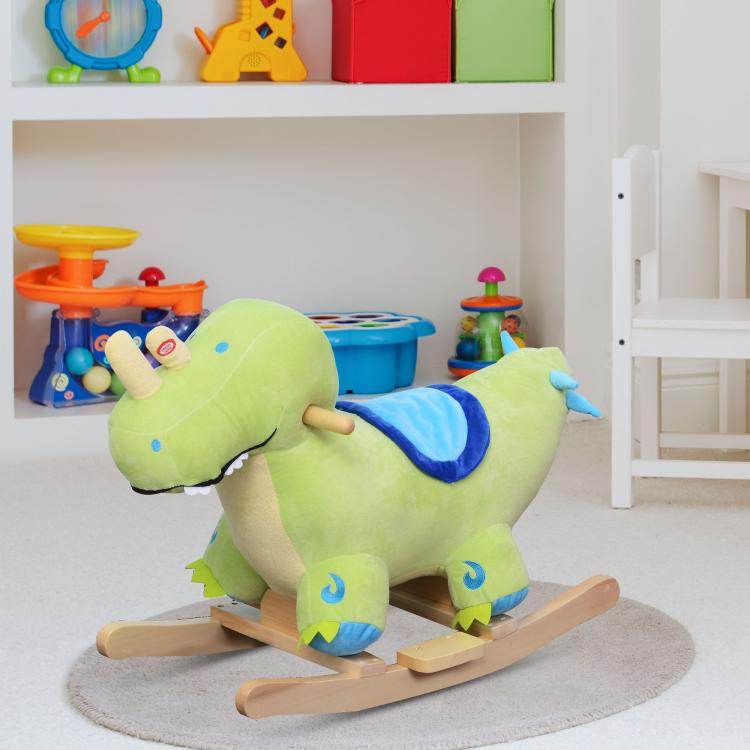 Green plush dinosaur ride-on rocking horse with blue saddle, wooden base, and horn sound