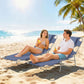 Pair of dark blue outdoor chaise lounges with face openings, padded headrests, steel frames