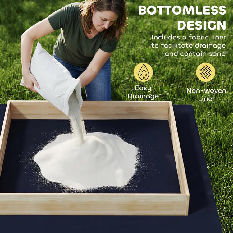 Wooden sandbox with bottom fabric liner, sand draining from the tray
