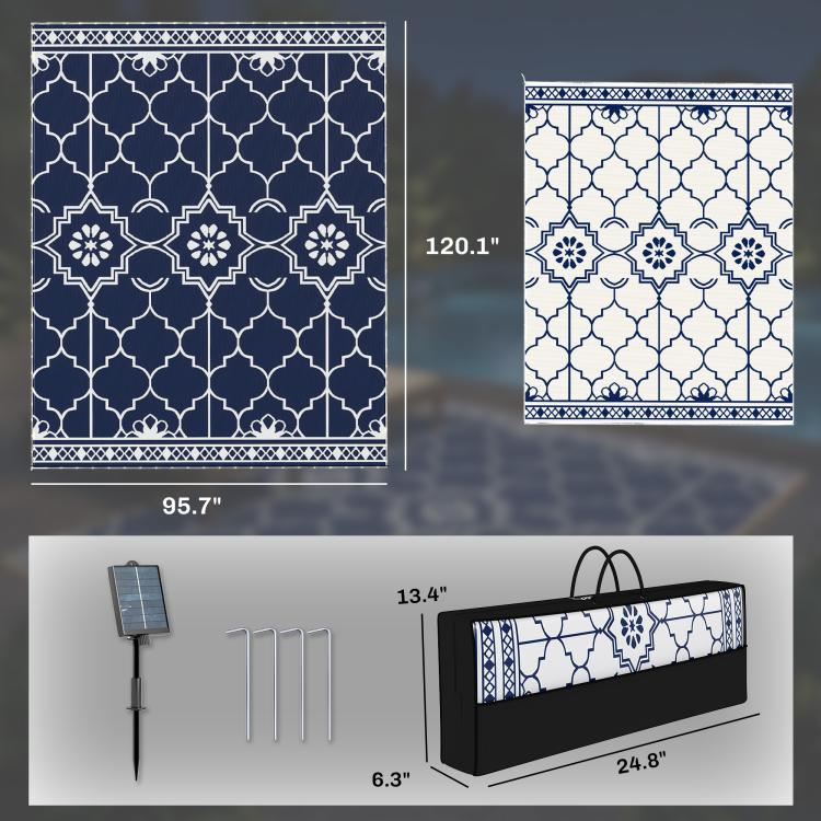 Reversible rug in dark blue and white, with carry bag and ground stakes shown