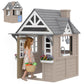 Wooden kids playhouse with gray roof, side doorway, window panels, and flower box planters