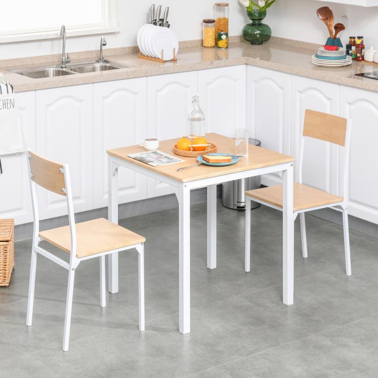 White square dining table set with wood-tone seats and chairs beside the tabletop.