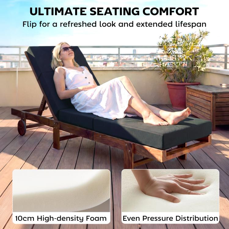 Dark gray chaise lounge cushion on outdoor chaise chair, headrest included