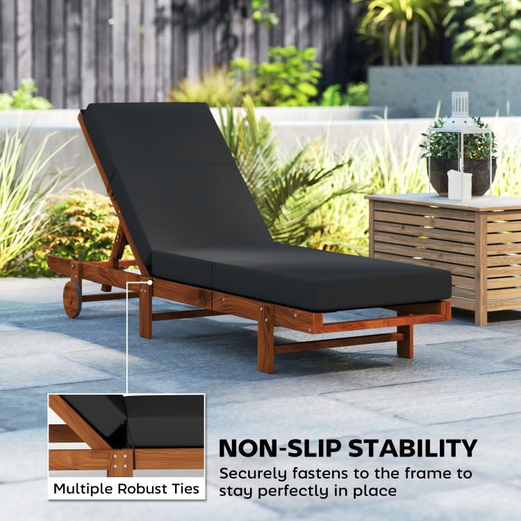 Dark gray chaise lounge cushion on frame with headrest and tie-down straps