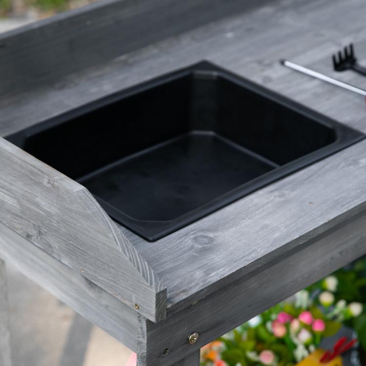 Gray wooden potting bench with square sink basin and black liner