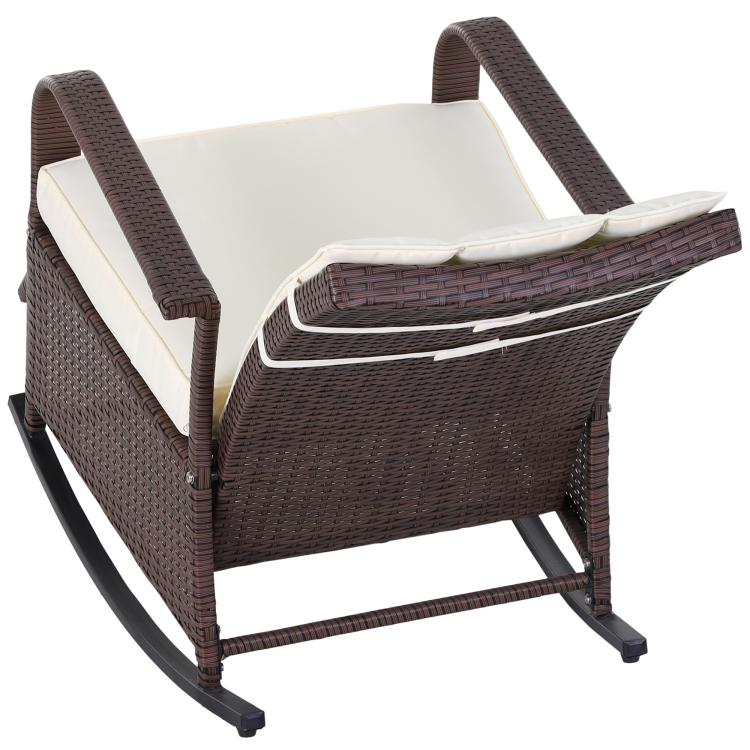 Angled view of beige-cushioned rattan rocking recliner with footrest and curved base
