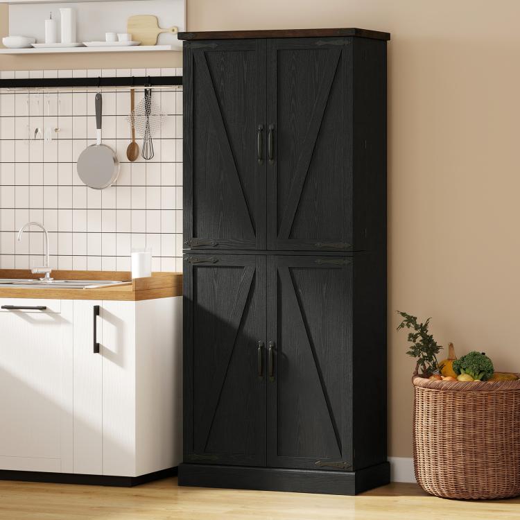 Black tall pantry cabinet with paneled barn doors and two sets of metal handles